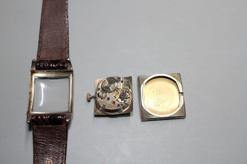 A gentlemans 1930s? 10k gold filled Gruen Precision manual wind wrist watch, with rectangular Roman and baton dial